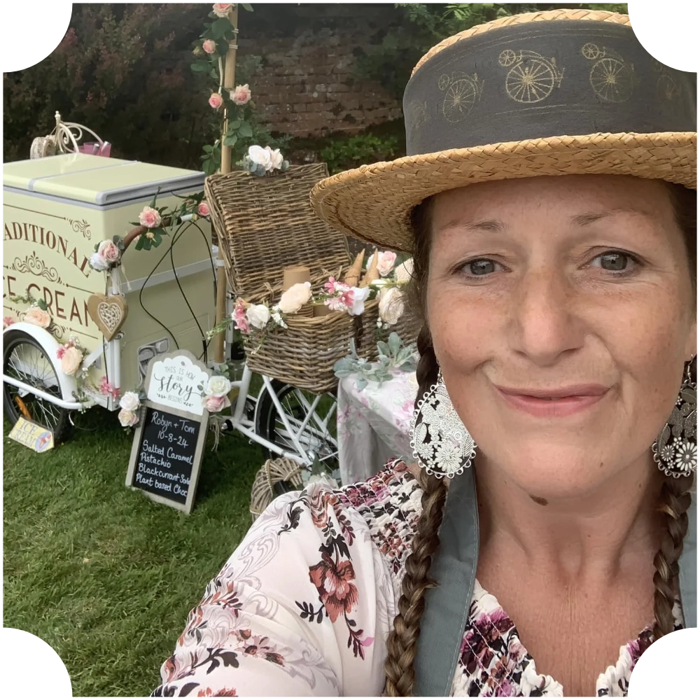 Vintage Chic Event Hire owner with a vintage ice cream cart and floral wedding décor